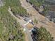 Aerial view of a new construction home on a large lot, surrounded by trees and a long driveway at 847 Cumberland Ave, Dallas, GA 30157