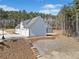 Aerial view of home and backyard featuring multiple garage spaces and a basketball hoop at 847 Cumberland Ave, Dallas, GA 30157