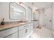 Modern bathroom with double vanity, granite countertop, and brushed gold hardware at 847 Cumberland Ave, Dallas, GA 30157