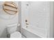 Stylish bathroom featuring a white subway tile shower and decorative bamboo shelf, with modern fixtures at 847 Cumberland Ave, Dallas, GA 30157