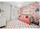 Bright bedroom with floral wallpaper, daybed, checkerboard rug, and natural light at 847 Cumberland Ave, Dallas, GA 30157