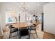 Open-concept dining area connecting to the kitchen, with wood floors and stylish decor at 847 Cumberland Ave, Dallas, GA 30157