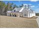 Beautiful single-Gathering home with a covered front porch, a sprawling lawn, and a side-entry garage at 847 Cumberland Ave, Dallas, GA 30157