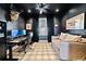 Home office with dark walls, decorative ceiling fan, and plaid carpet at 847 Cumberland Ave, Dallas, GA 30157