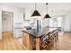 Beautiful kitchen featuring an island with seating, modern appliances, and bright, white cabinetry at 847 Cumberland Ave, Dallas, GA 30157