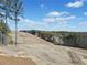 Expansive land with newly installed straw and growing trees, showcasing a potential building site with blue skies at 847 Cumberland Ave, Dallas, GA 30157