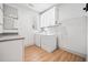 Bright laundry room with white appliances and storage at 847 Cumberland Ave, Dallas, GA 30157