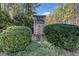 Entrance to Harris Place community featuring a brick sign surrounded by lush greenery at 847 Cumberland Ave, Dallas, GA 30157