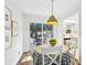 Bright dining area with a round table, white chairs, and sliding doors to the backyard at 136 Peachtree Memorial Nw Dr # Sc-4, Atlanta, GA 30309