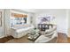 Bright living room featuring a white sofa, armchairs, and a glass coffee table, illuminated by natural light at 136 Peachtree Memorial Nw Dr # Sc-4, Atlanta, GA 30309