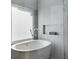 Elegant bathroom features a luxurious soaking tub with modern fixtures and stylish tile work at 1377 Village Park Ne Dr, Brookhaven, GA 30319