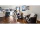 Comfortable room with dark wood floors, two armchairs, desk, shelves, and stylish decor at 1377 Village Park Ne Dr, Brookhaven, GA 30319