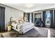 Comfortable bedroom featuring hardwood floors, modern decor, and plenty of natural light at 1377 Village Park Ne Dr, Brookhaven, GA 30319