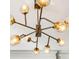 Close up of a modern light fixture with spherical glass shades at 1377 Village Park Ne Dr, Brookhaven, GA 30319