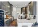 Well-appointed kitchen featuring stainless appliances, marble countertops, and a wine fridge at 1377 Village Park Ne Dr, Brookhaven, GA 30319