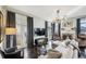 Bright living room with a fireplace, modern lighting, and hardwood floors at 1377 Village Park Ne Dr, Brookhaven, GA 30319