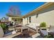 Spacious outdoor patio featuring multiple seating areas, stylish rugs, and wood railings at 1377 Village Park Ne Dr, Brookhaven, GA 30319