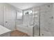 Bright bathroom with a separate shower and tub, wood look flooring, and white marble design at 280 Rockledge Sw Bnd, Powder Springs, GA 30127
