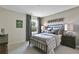Charming bedroom features a cozy plaid bed set, bedside lamps, and a decorative 'Adventure' sign at 280 Rockledge Sw Bnd, Powder Springs, GA 30127
