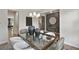 Open concept dining room with a glass table, stylish chairs and decor at 280 Rockledge Sw Bnd, Powder Springs, GA 30127