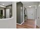 Hallway with hardwood floors and neutral walls, leading to various rooms within the home at 280 Rockledge Sw Bnd, Powder Springs, GA 30127
