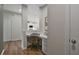 A compact home office nook with a desk, chair, and natural light at 280 Rockledge Sw Bnd, Powder Springs, GA 30127