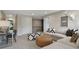 Upstairs living room featuring a large sectional sofa, desk, modern artwork, and contemporary decorations at 280 Rockledge Sw Bnd, Powder Springs, GA 30127