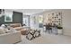 Comfortable living room featuring a sectional sofa, contemporary art, and a view of the connecting bedroom at 280 Rockledge Sw Bnd, Powder Springs, GA 30127