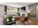 Cozy living room showcasing natural light, fireplace, comfortable seating, and stylish decor at 280 Rockledge Sw Bnd, Powder Springs, GA 30127