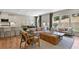 Open-concept living space featuring kitchen, dining, and living room with modern furnishings at 280 Rockledge Sw Bnd, Powder Springs, GA 30127