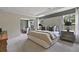 Inviting main bedroom featuring a cozy sitting area, soft lighting, and a relaxing atmosphere with backyard view at 280 Rockledge Sw Bnd, Powder Springs, GA 30127