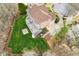 Backyard aerial view with a large deck, fire pit, and meticulously maintained lawn at 4865 Meadow Park Ln, Suwanee, GA 30024