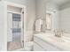 Clean and modern bathroom featuring a sleek white vanity and a glass-enclosed shower at 4865 Meadow Park Ln, Suwanee, GA 30024