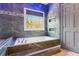 Bathroom showcasing a soaking tub, wall accents and modern finishes at 4865 Meadow Park Ln, Suwanee, GA 30024