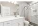 Modern bathroom with glass-enclosed shower, bright lighting, and a sleek, white vanity at 4865 Meadow Park Ln, Suwanee, GA 30024