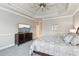 Bright and airy bedroom with tray ceiling and carpet flooring at 4865 Meadow Park Ln, Suwanee, GA 30024
