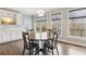 A lovely dining area with lots of natural light and a view of the backyard at 4865 Meadow Park Ln, Suwanee, GA 30024
