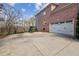 A spacious driveway that leads to a three-car garage at 4865 Meadow Park Ln, Suwanee, GA 30024