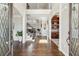 Grand foyer with dark hardwood floors, staircase and access to the home's interior at 4865 Meadow Park Ln, Suwanee, GA 30024