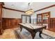 Game room with a pool table, custom wainscoting, and a decorative rug at 4865 Meadow Park Ln, Suwanee, GA 30024