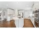 A beautifully designed kitchen with stainless steel appliances and hardwood floors at 4865 Meadow Park Ln, Suwanee, GA 30024