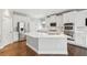 A newly remodeled kitchen with stainless steel appliances, custom cabinets, and a center island at 4865 Meadow Park Ln, Suwanee, GA 30024