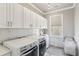 Efficient laundry room featuring modern appliances and ample counter space for all your laundry needs at 4865 Meadow Park Ln, Suwanee, GA 30024