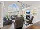 Spacious living room with soaring ceilings, large arched window, fireplace and modern decor at 4865 Meadow Park Ln, Suwanee, GA 30024