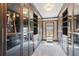 Spacious walk-in closet with mirrored sliding doors and custom shelving for optimal storage at 4865 Meadow Park Ln, Suwanee, GA 30024