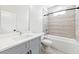 Neutrally-toned bathroom showcases tiled shower and gray vanity with hard surface top at 622 Bellemeade Nw Ave # 2, Atlanta, GA 30318