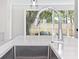 Close up of a kitchen sink and chrome faucet with white countertop at 622 Bellemeade Nw Ave # 2, Atlanta, GA 30318