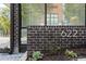 Close up on the house number 622 set in a brick facade with green plants at 622 Bellemeade Nw Ave # 2, Atlanta, GA 30318