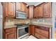 Cozy kitchen featuring stainless steel appliances, granite countertops, and ample cabinet space at 31 Roberson Ne Dr, Cartersville, GA 30121