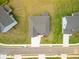 Aerial view of the home showcasing the well manicured lawn and paved driveway at 3114 Thicket Ln, Atlanta, GA 30349